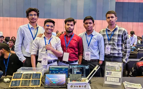 Team members behind solar panels, laptops, and a PV array optimizer project display at India Innovates 2026 in Delhi