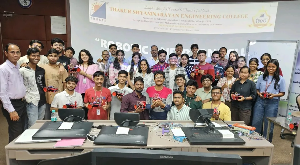 Shubham Sahu with students and faculty holding wheeled robot prototypes at the first TSEC robotics workshop