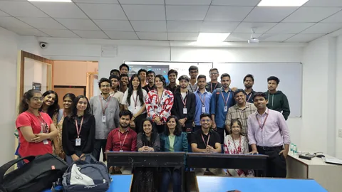 Students and faculty gathered for a classroom photograph.
