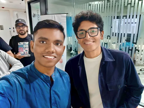 A group selfie at an indoor gathering.