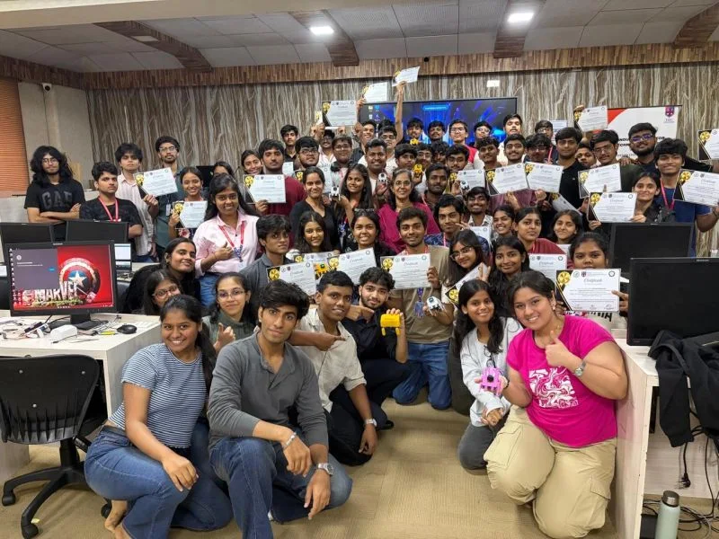 Participants holding their certificates and walking robots at the Aurigen workshop